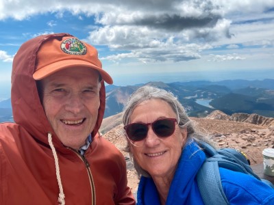 Bob and his wife Nancy on top of a mountain